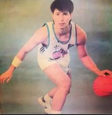 a man in a photoshoot taking a dribble
